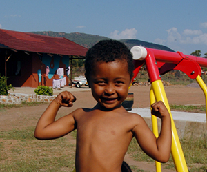 Boy flexing his muscles - cropped